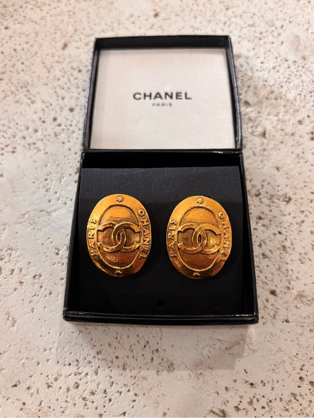 Authentic CHANEL 1990s gold plated oval clip on earrings